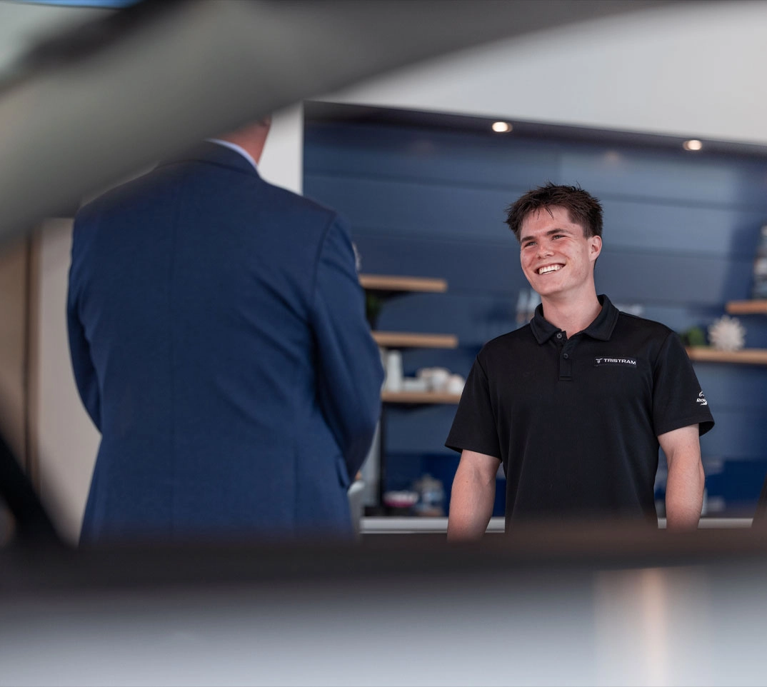 Tristram Auckland Staff Discussing Premium Automotive Care with a Client